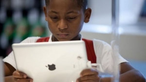 child-with-ipad-via-afp-615x345